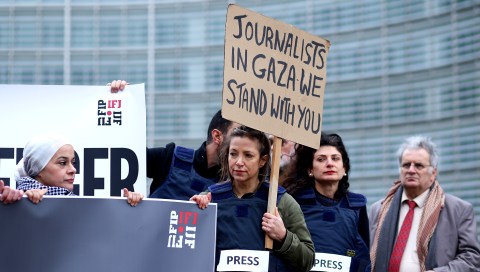 Representatives of the International Federation of Journalists (IFJ) attend a vigil for journalists killed in Gaza, in Brussels, Belgium, on 5 February 2024. The IFJ said at least 100 journalists and media workers have been killed since the Israeli-Gaza conflict started on 7 October 2023, with many injured or missing. The IFJ represents more than 600,000 journalists. (Photo: EPA-EFE / OLIVIER HOSLET)